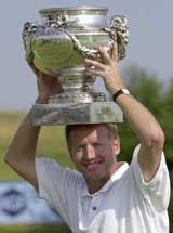 Philip Golding of England holds his trophy after winning the French Open at Saint Quentin en Yvelines 