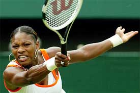 Serena Williams of the US returns to Russia's Elena Dementieva in their fourth-round match at the Wimbledon Tennis championships in London