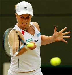 Belgium's Kim Clijsters returns to Japan's Ai Sugiyama