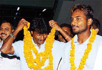 Indian hockey captain Dhanraj Pillay and his teammate Kamaldeep Singh arrive at IGI Airport