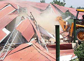 The enforcement team of the UT Administration demolishes the structure of Panchvati farmhouse on the 