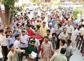 A heavy rush of people outside a Reliance showroom as the company started offering WLL sets for Rs 501 only, in Ludhiana on Wednesday.