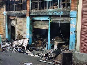 Three shops which were gutted by fire in Hamirpur on Wednesday night