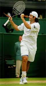 France's Sebastien Grosjean celebrates his victory over Tim Henman of Britain