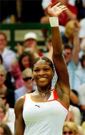 Serena Williams of the US waves to the crowd after defeating Belgium�s Justine Henin-Hardenne