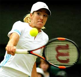 Belgium's Justine Henin-Hardenne returns to Serena Williams of the US