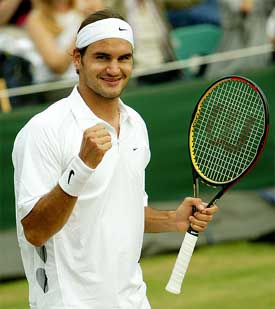 Switzerland's Roger Federer celebrates his victory over Sjeng Schalken of the Netherlands