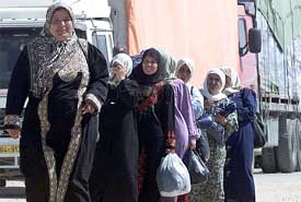 A group of Palestinian women, who work in Israel, return to Tulkarem