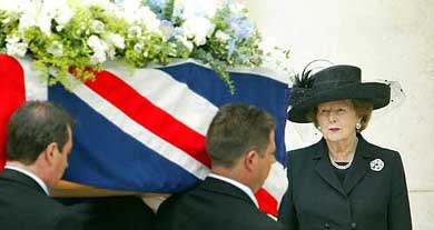 Former British Prime Minister Margaret Thatcher watches as the coffin of her late husband Denis is carried into the Chapel at the Royal Hospital, Chelsea