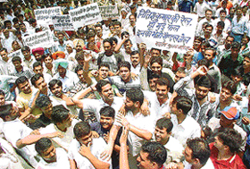 Indian Youth Congress activists hold a demonstration demanding immediate resignation of Union Minister for Railways Nitish Kumar