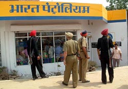 Vigilance officials search the petrol pump at Killianwali village 