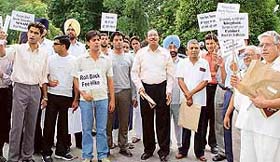 Fellows of Panjab University join students at a dharna staged against the proposed fee hike in colleges