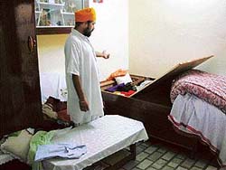 Baldev Singh shows a room of his house that was ransacked by thieves in Ludhiana on Friday.