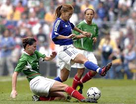 Japan's Homare Sawa controls the ball as Mexico's Fatima Leyva attempts a sliding tackle