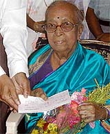 Eminent classical singer Dr. Gangubai Hingal receives a cheque 