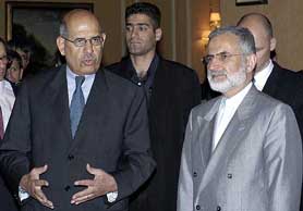International Atomic Energy Agency chief Mohamed ElBaradei and Iranian Foreign Minister Kamal Kharrazi speak with journalists after a meeting