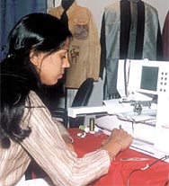A participant at the ZAK Garmentech International 2003 at Pragati Maidan in the Capital on Thursday. 