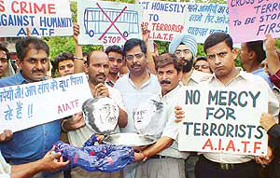 Members of the local unit of the All India Anti-Terrorist Front protest against the resumption of the Delhi-Lahore bus service, in Chandigarh on Friday.