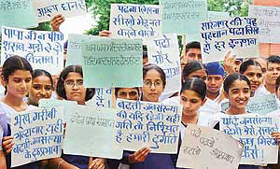 Students holding placards take out a rally on the World Population Day in Chandigarh on Friday.