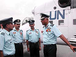 Air Chief Marshal S. Krishnaswamy has a word with Air Force officials before flagging off the IAF peacekeeping contingent for Congo 