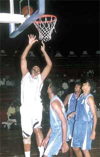 Indian cager Parminder Singh attempts to score a point 