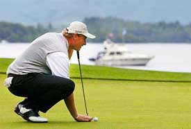 South African golfer Ernie Els prepares for his putt shot