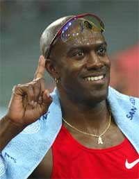 Allen Johnson of the US celebrates his victory in the men's 110-metre hurdles 