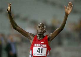 Abraham Chebii of Kenya celebrates his victory in the men's 5,000-metre race