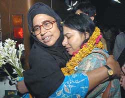 Pakistani national Sabba, who was stranded in India, is hugged by her mother-in-law on her arrival in Lahore from Delhi on Friday.