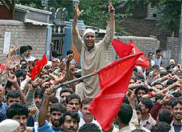 National Conference supporters head towards the martyrs' graveyard in Srinagar 