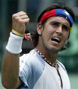 Jose de Armas of Venezuela celebrates his victory over Marcelo Rios of Chile