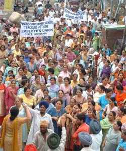 Members of the Government-aided School Teachers Union hold a rally in Ludhiana