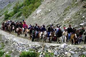 Tourists form a queue on their way to the cave shrine of Amarnath
