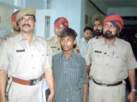 Shiv Shankar with a police party which arrested him