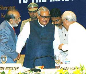 Prime Minister Atal Bihari Vajpayee being greeted by West Bengal Governor Viren J Shah and Chief Minister Buddhadev Bhattacharjee