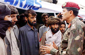 Lt-Gen-V.G. Patankar, General Officer Commanding of 15 Corp, talks to 24 militants after their surrender