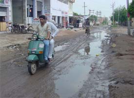 The potholed Shaheed Avtar Singh road in Khamano
