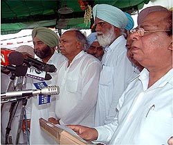 Punjab Local Bodies Minister Jagjit Singh and chairman of High Powered Finance Committee Surinder Singla at the oath taking ceremony 