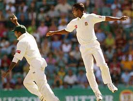 Bangladeshi bowler Tapash Baisya celebrates the dismissal of Ricky Ponting of Australia with team-mate Habibul Bashar