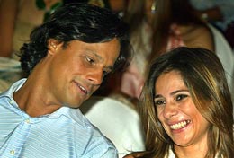 Indian business tycoon Arun Nayar talks to friend and socialite Hasian Jethmalani during the India Fashion Week in Mumbai on Saturday. 