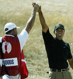 Tiger Woods of the US celebrates his birdie