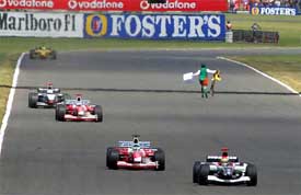 An unidentified man runs on the Hangar Straight section of the track