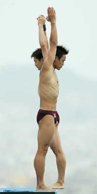 China�s Jia Hu and Liang Tiang dive in the men�s synchronised 10 metres platform preliminaries