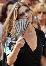 Catherine Zeta Jones uses a fan in the maritime port