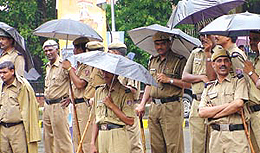 The police personal at Jantar Mantar during the rain in the Capital on Monday. 