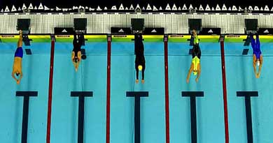 Swimmers make a splashing start during the 400-metre freestyle final event 