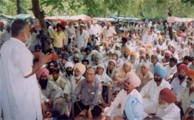 The state secretary of the CPI-M, Mr Mangat Ram Pasla, addresses a protest rally at Mini Secretariat
