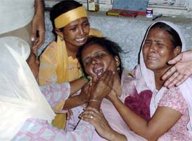 Wailling family members of Harpreet Singh who died in an attack by militants 