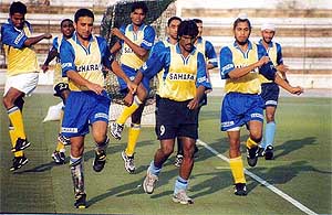 The Indian hockey team practices at the Sports College in Lucknow