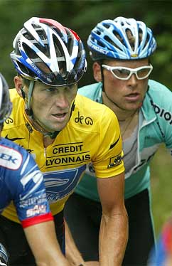 US Postal Service team rider Lance Armstrong rides alongside Bianchi team rider Jan Ullrich of Germany